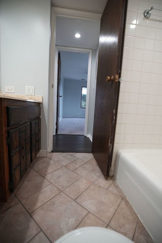 bathroom with tile patterned floors and vanity