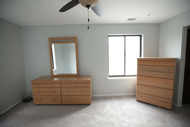 unfurnished bedroom featuring ceiling fan and light colored carpet