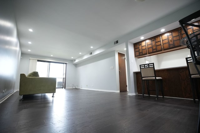 unfurnished living room featuring dark hardwood / wood-style floors