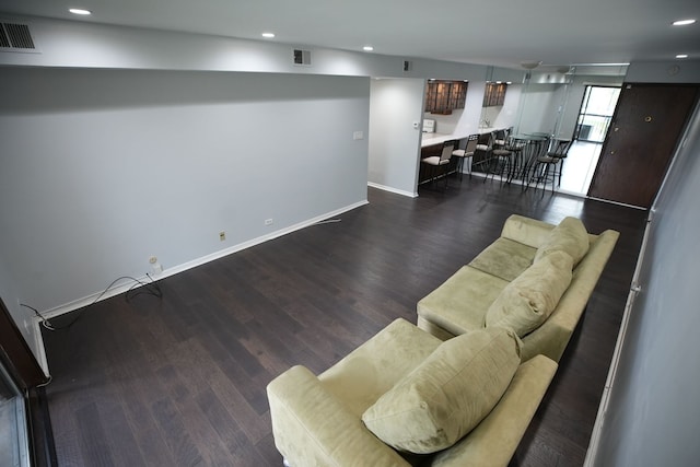 living room featuring dark hardwood / wood-style flooring