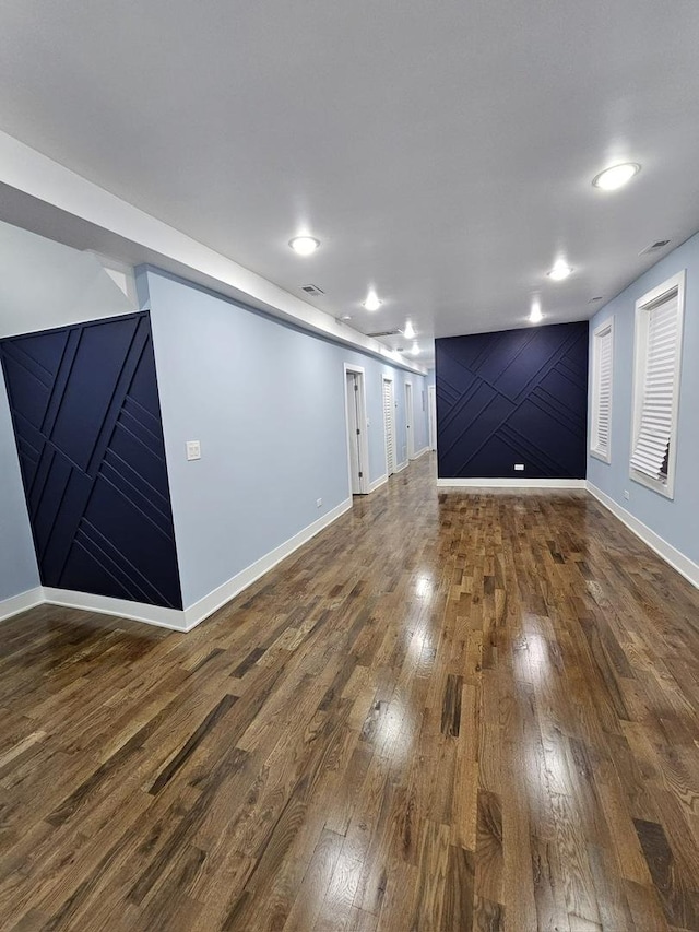 unfurnished room with hardwood / wood-style floors