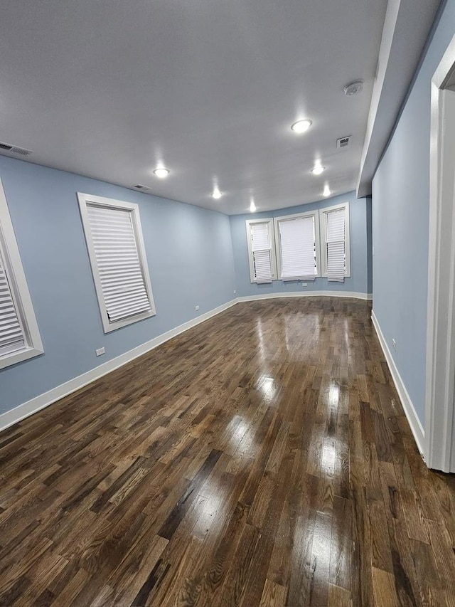 unfurnished room featuring dark hardwood / wood-style flooring