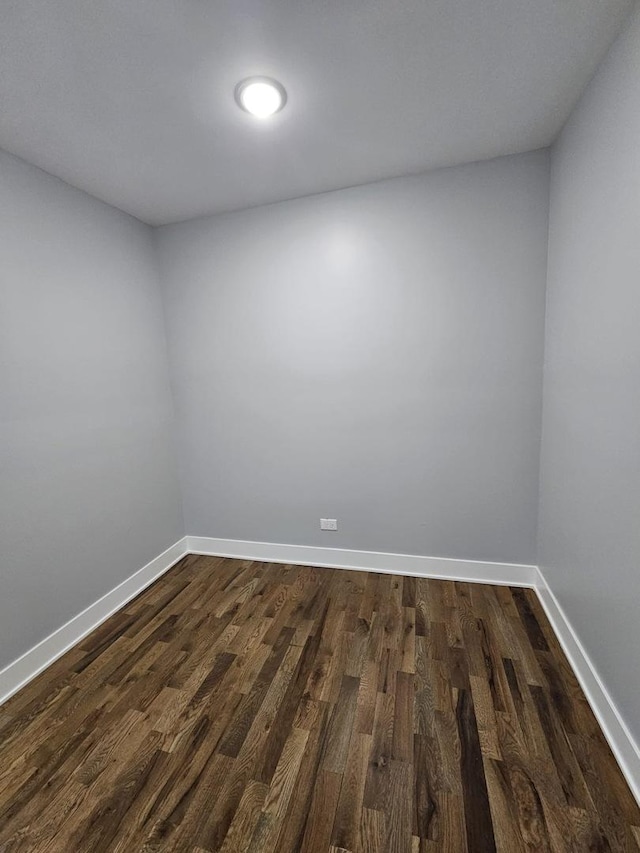 empty room featuring dark wood-type flooring