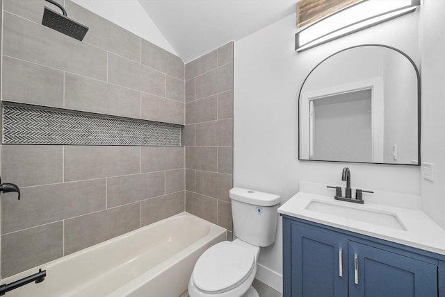 full bathroom featuring lofted ceiling, vanity, toilet, and tiled shower / bath