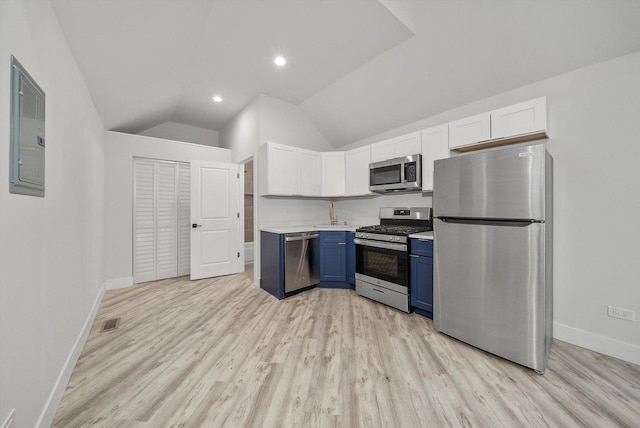 kitchen featuring vaulted ceiling, electric panel, white cabinetry, stainless steel appliances, and blue cabinets