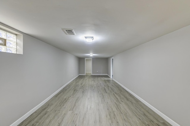 basement with light wood-type flooring