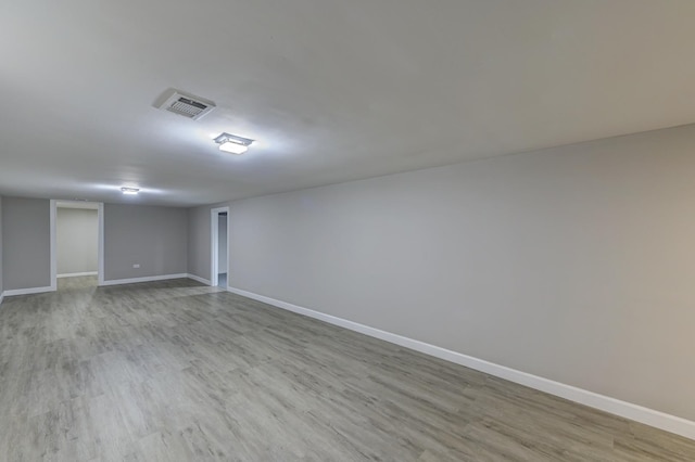 unfurnished room with light hardwood / wood-style flooring