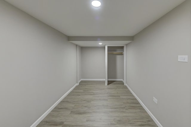 unfurnished bedroom with a closet and light hardwood / wood-style flooring