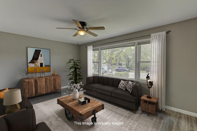 living room with hardwood / wood-style floors and ceiling fan