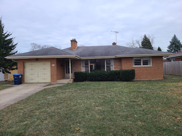 ranch-style home with a garage and a front lawn