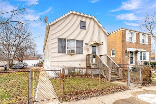 view of front of house featuring cooling unit and a front yard