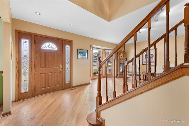 entryway with light hardwood / wood-style flooring