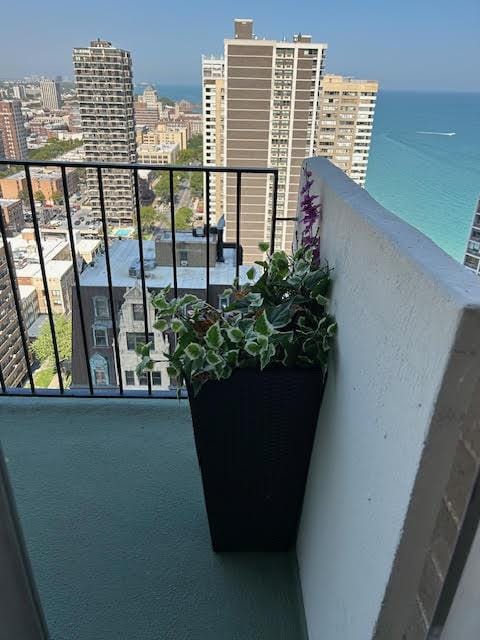 balcony featuring a water view