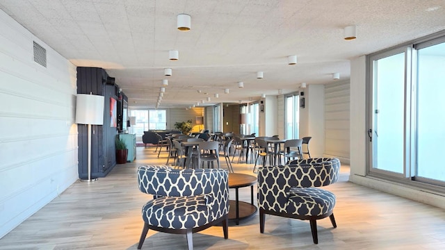 dining space featuring light wood-type flooring