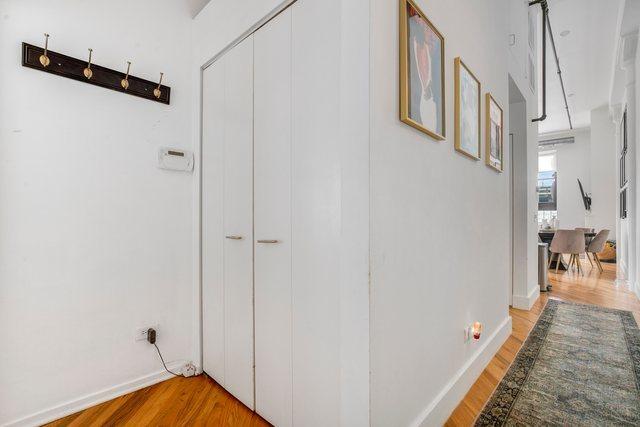 hallway with light wood-type flooring