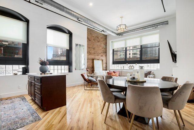 dining room featuring light wood-type flooring and plenty of natural light