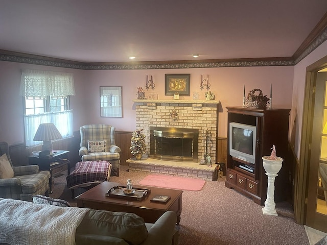 living room featuring crown molding, carpet flooring, and a fireplace