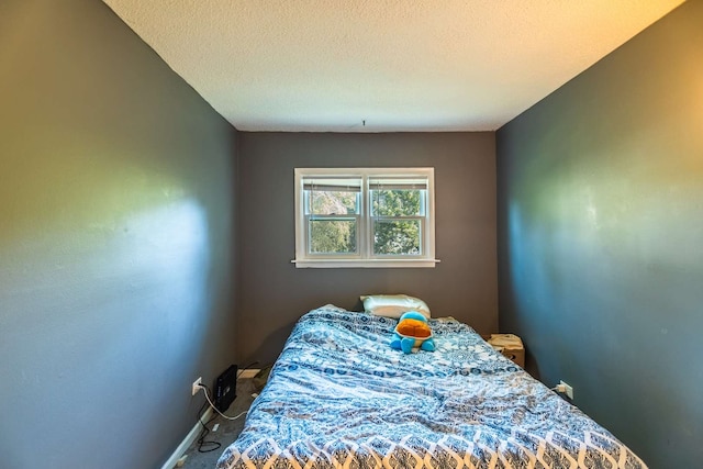 bedroom featuring a textured ceiling