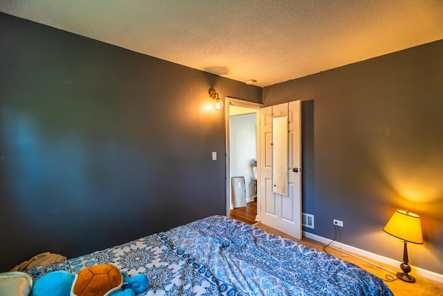 bedroom featuring a textured ceiling