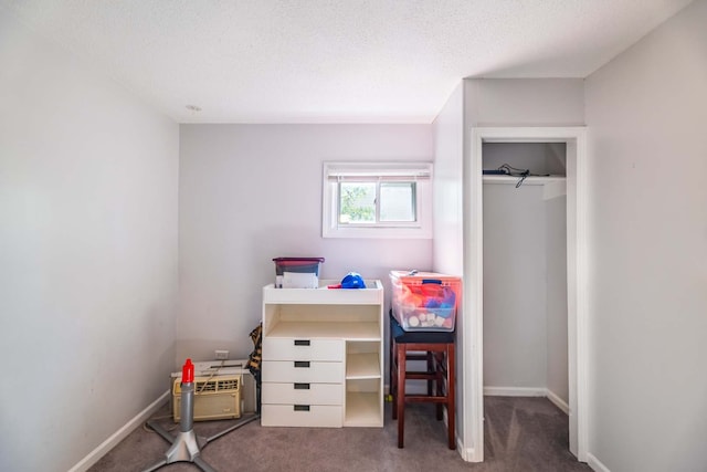 carpeted bedroom featuring a textured ceiling