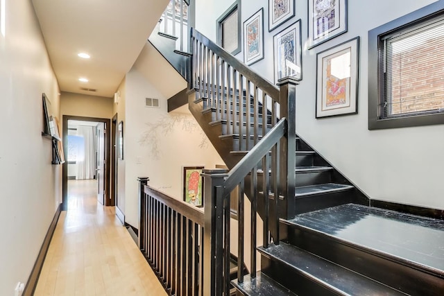 staircase featuring hardwood / wood-style flooring