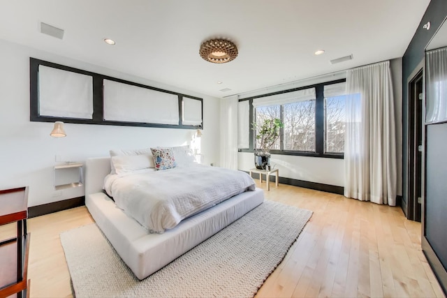 bedroom featuring light wood-type flooring