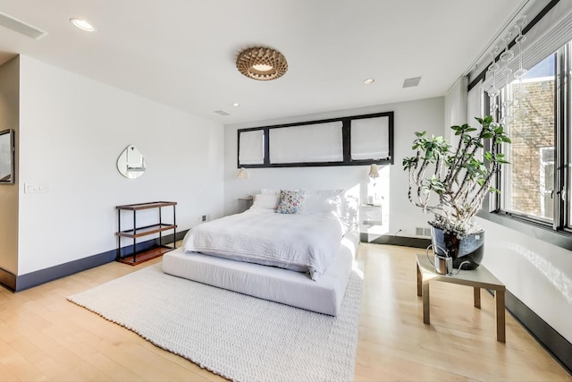 bedroom with light wood-type flooring