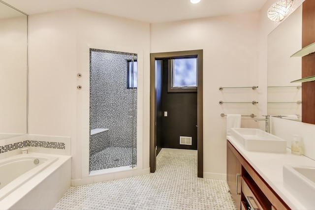 bathroom with vanity and plus walk in shower