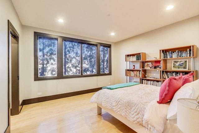 bedroom with light hardwood / wood-style floors