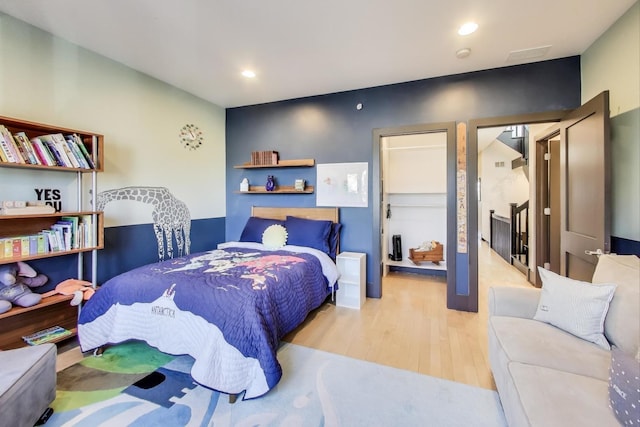 bedroom with light wood-type flooring