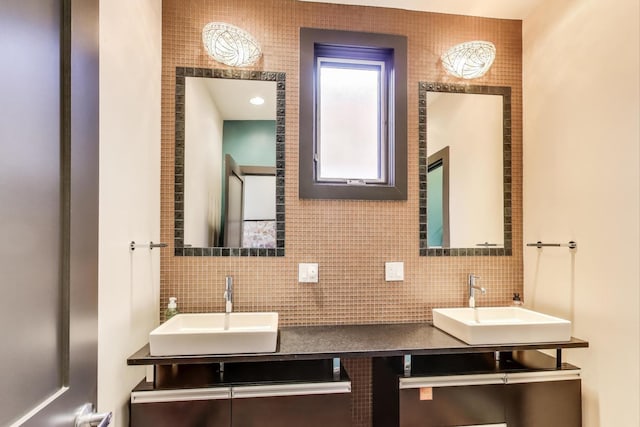 bathroom with vanity and backsplash