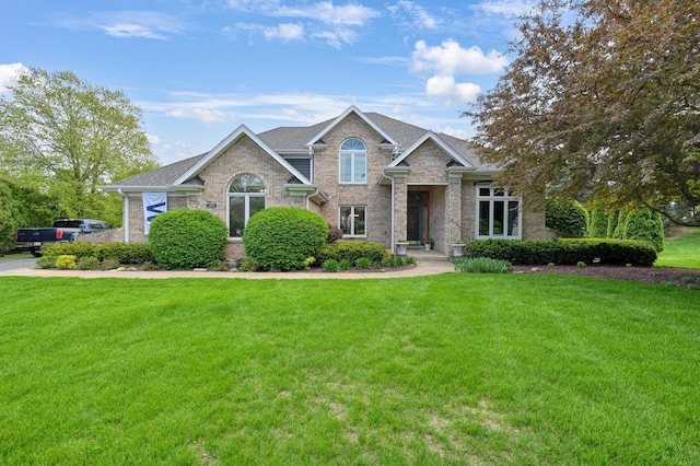 3430 Sandstone Ct, Lake In The Hills, IL 60156 - view of front of property featuring a front lawn, brick siding, and roof with shingles