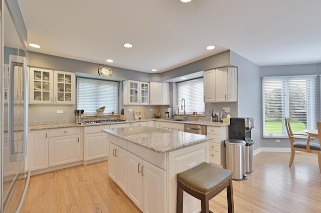 3430 Sandstone Ct, Lake In The Hills, IL 60156 - kitchen featuring a sink, stainless steel appliances, light wood-style flooring, a center island, and recessed lighting