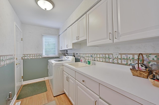 3430 Sandstone Ct, Lake In The Hills, IL 60156 - laundry area with cabinet space, separate washer and dryer, and light wood finished floors