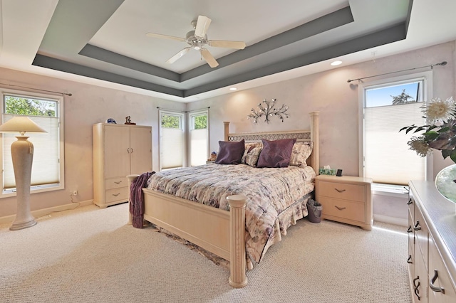 3430 Sandstone Ct, Lake In The Hills, IL 60156 - bedroom with light carpet, a raised ceiling, baseboards, multiple windows, and recessed lighting