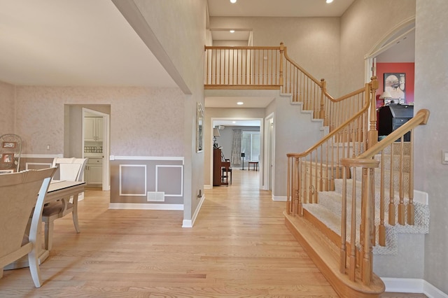 3430 Sandstone Ct, Lake In The Hills, IL 60156 - entrance foyer featuring wood finished floors, stairway, baseboards, a high ceiling, and recessed lighting