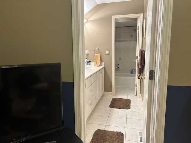 3430 Sandstone Ct, Lake In The Hills, IL 60156 - bathroom with tile patterned floors, vanity, and shower / tub combination