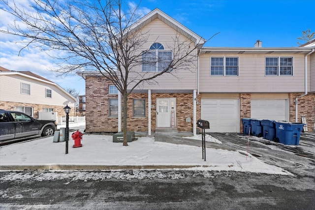 multi unit property featuring a garage