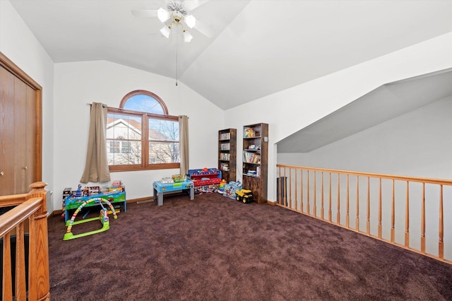 playroom with ceiling fan, carpet floors, and vaulted ceiling