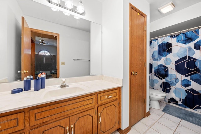 bathroom featuring toilet, ceiling fan, tile patterned floors, vanity, and curtained shower