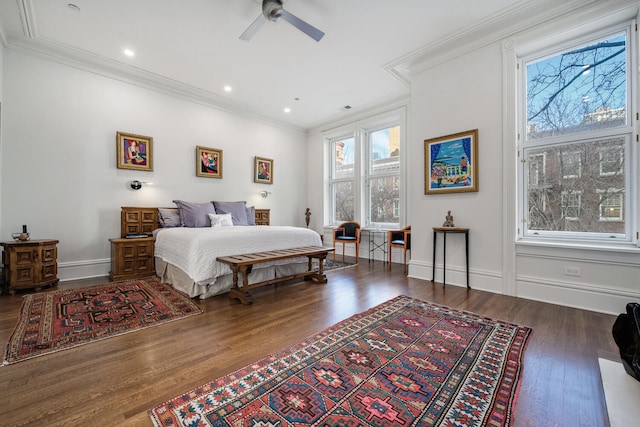 bedroom featuring ceiling fan, crown molding, and dark hardwood / wood-style floors