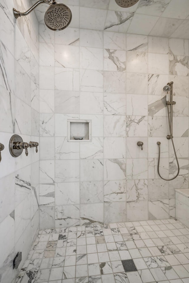 bathroom with tiled shower