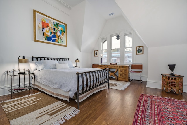 bedroom featuring lofted ceiling and dark wood-type flooring