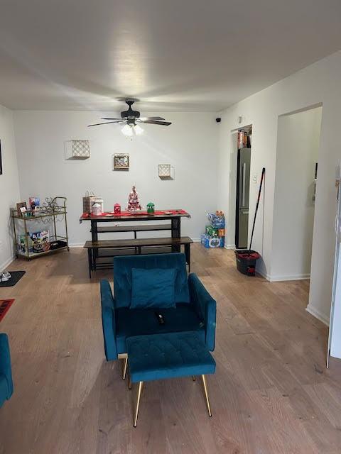 rec room featuring ceiling fan and hardwood / wood-style flooring