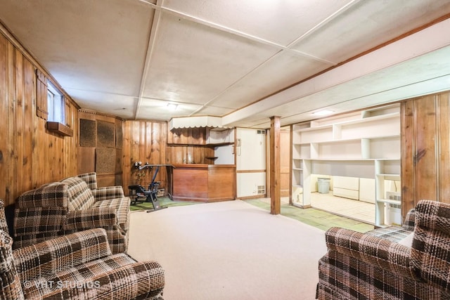 living room with wooden walls and carpet floors