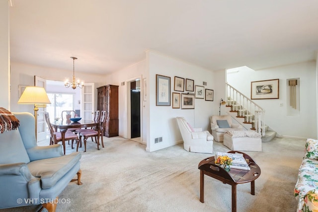 carpeted living room featuring ornamental molding and a notable chandelier