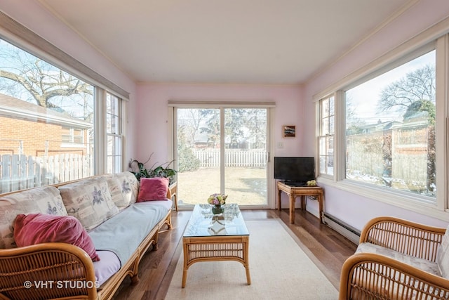 sunroom with baseboard heating and plenty of natural light