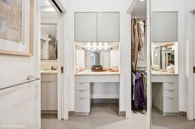 interior space with tile patterned flooring and vanity