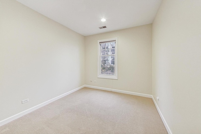 spare room featuring carpet flooring