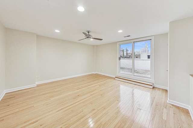 unfurnished room featuring ceiling fan and light wood-type flooring